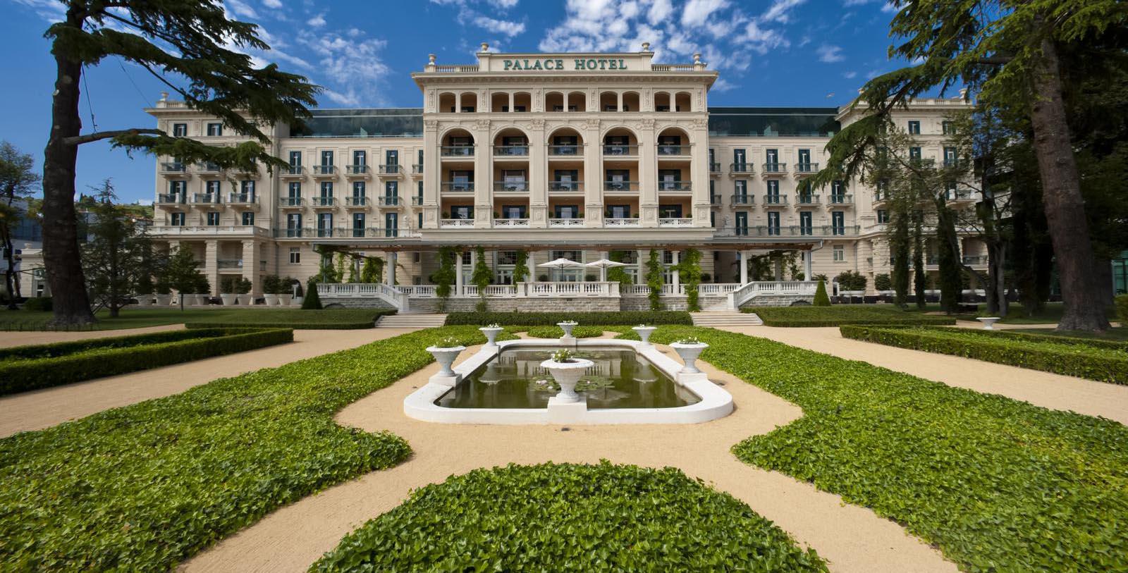 a large building with a fountain in front of it