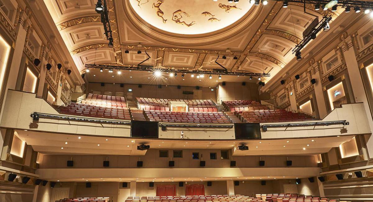 a large auditorium with rows of seats