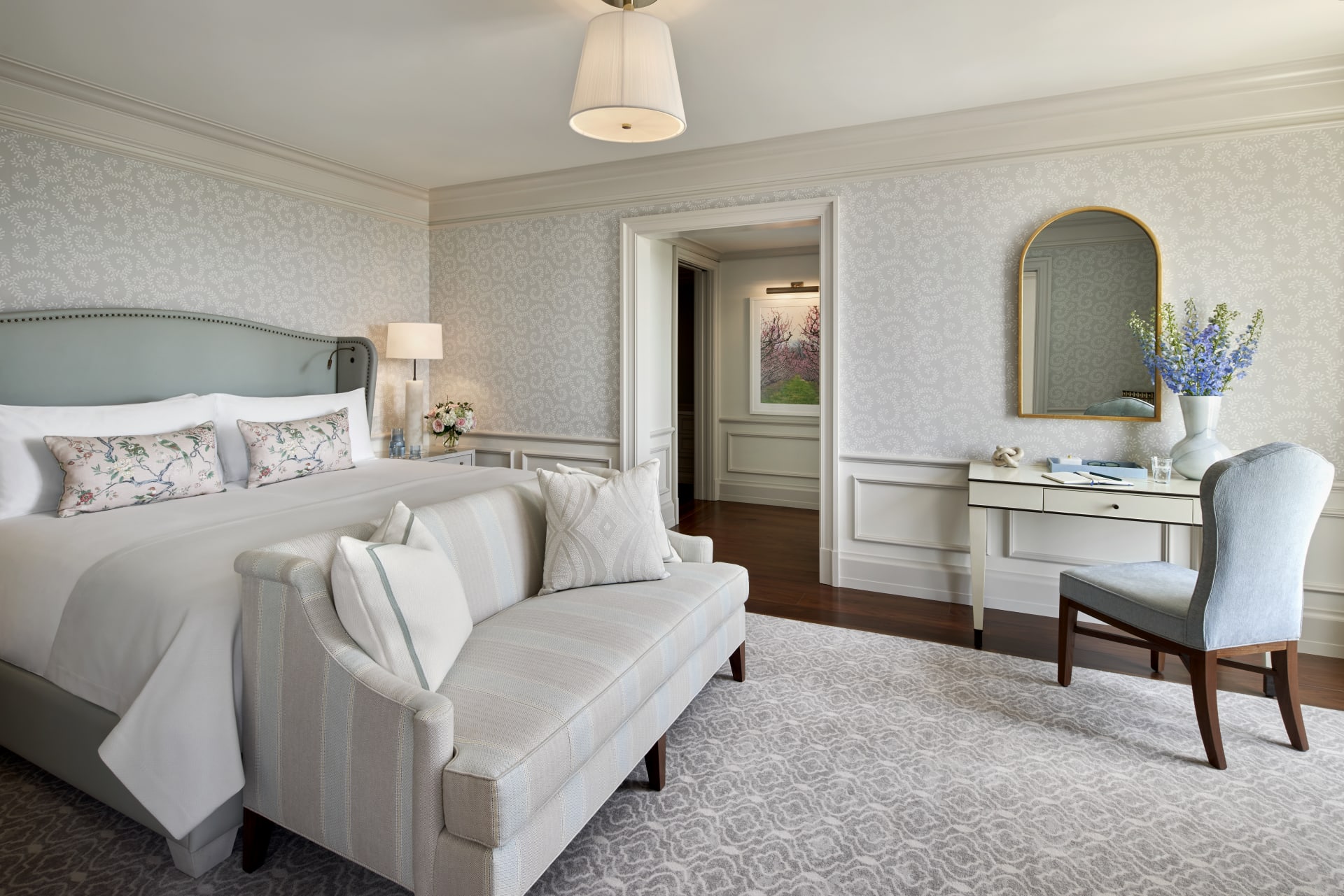 a bedroom with a bed and a couch