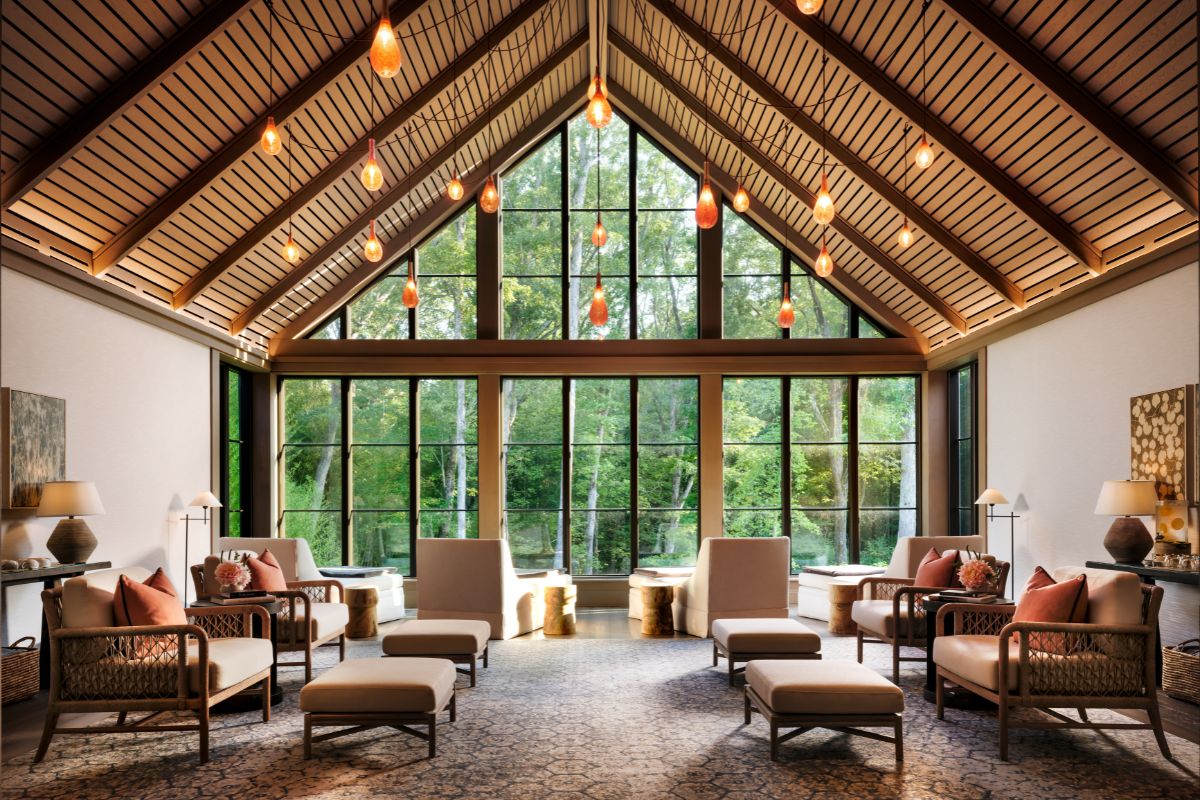 a room with many chairs and a large window