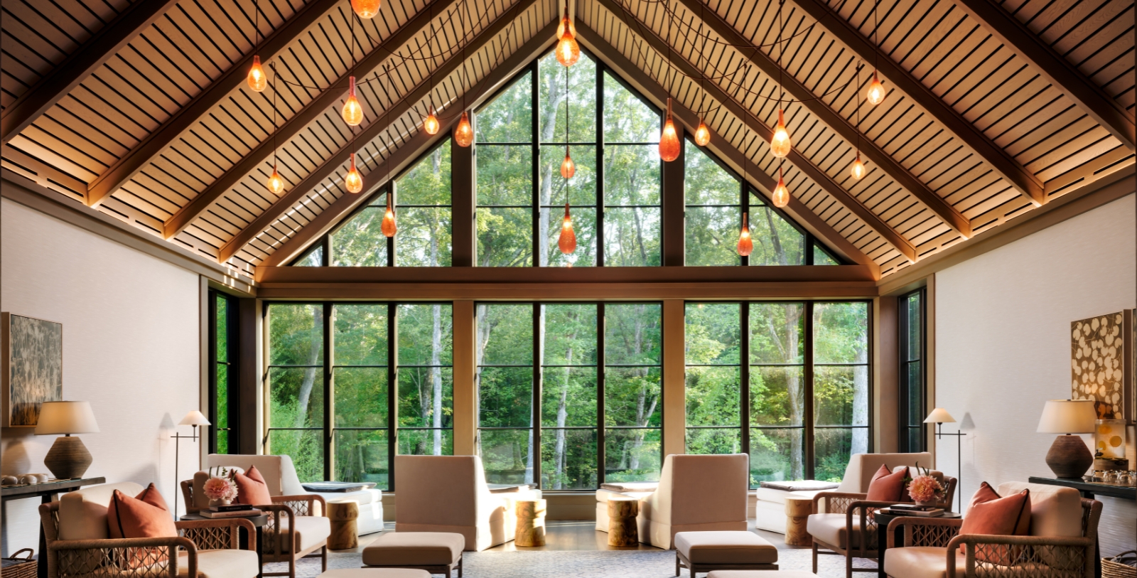 a room with a large window and chairs