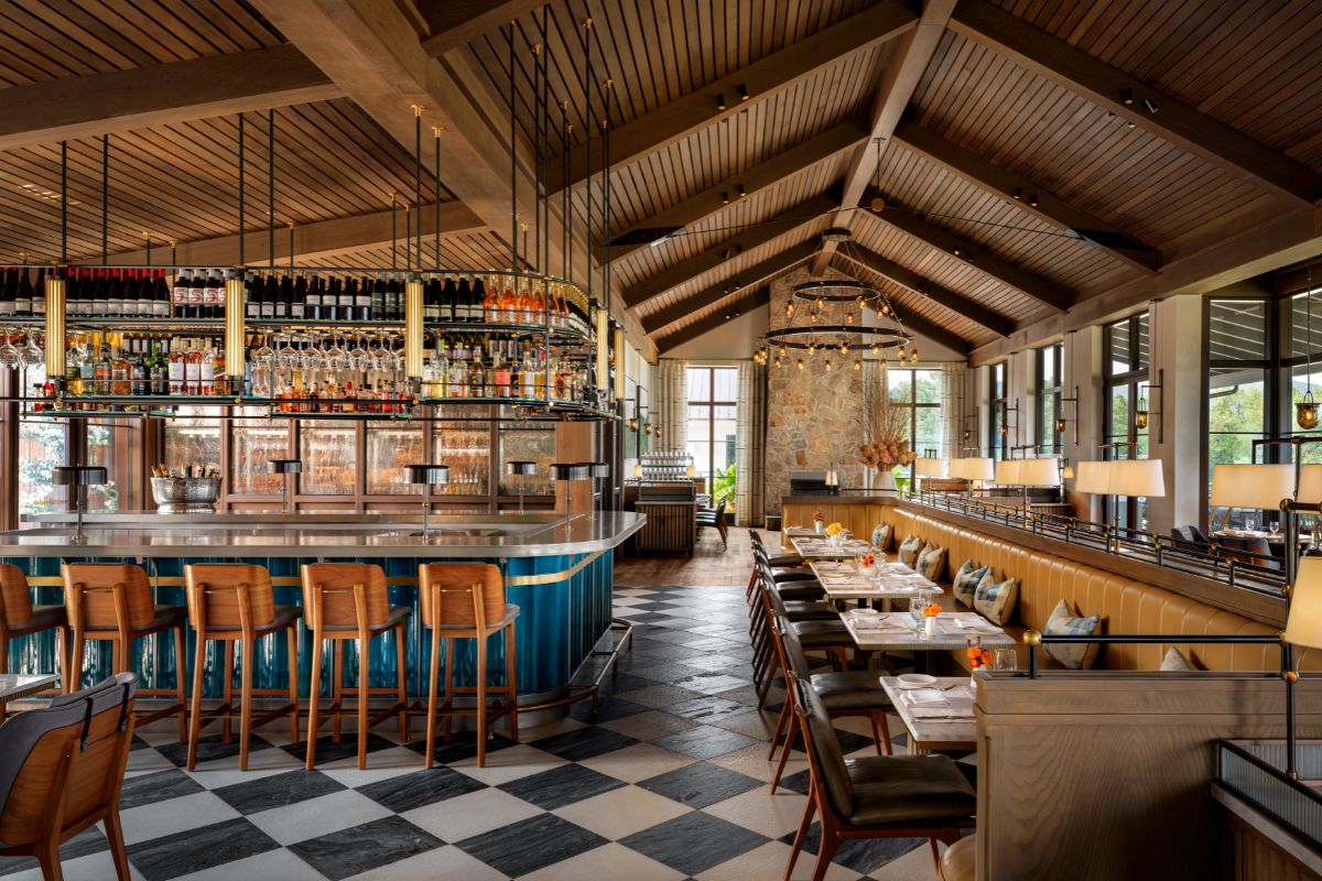 a restaurant with a bar and chairs