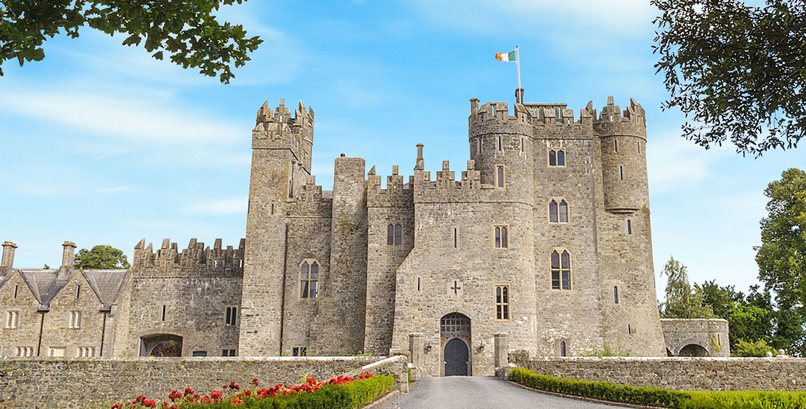 a stone castle with a flag on top