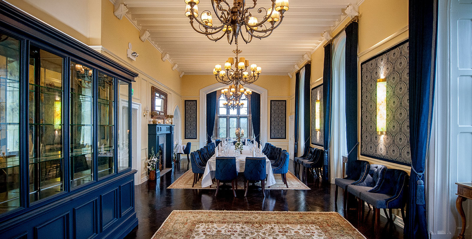 a room with a large table and chairs