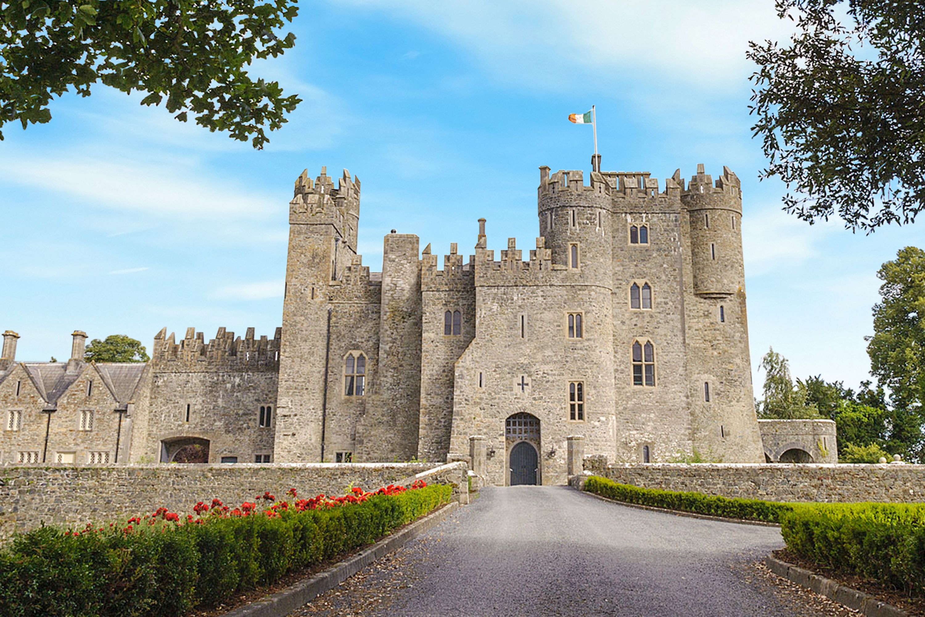 a stone castle with a flag on top