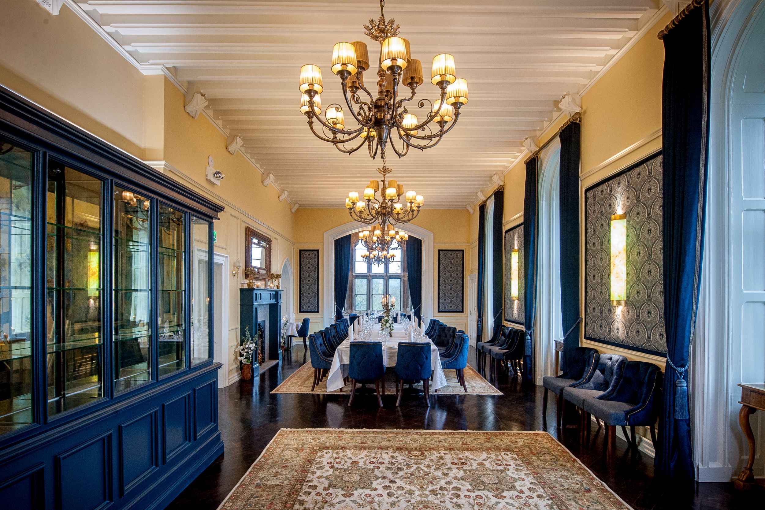 a room with a chandelier and chairs