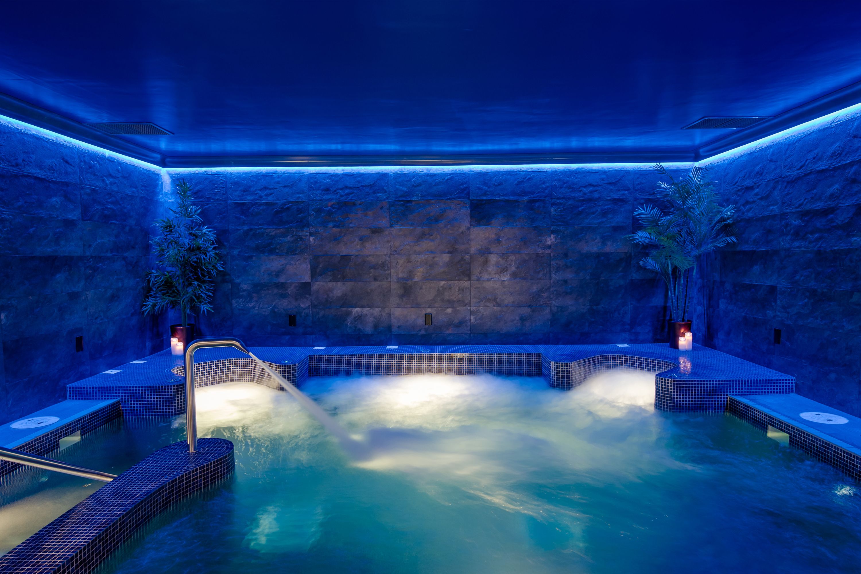 a hot tub with a waterfall