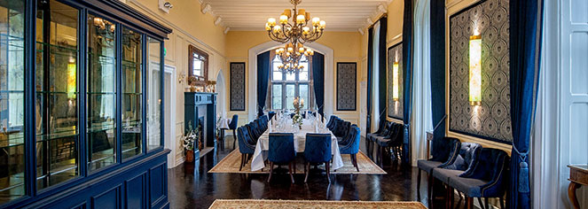 a room with a large table and chairs