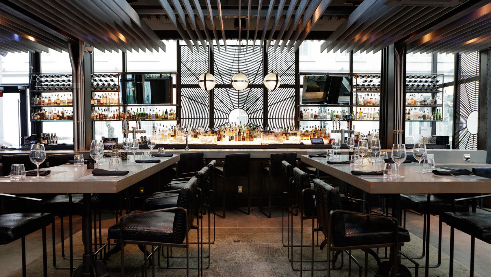 a bar with many tables and chairs