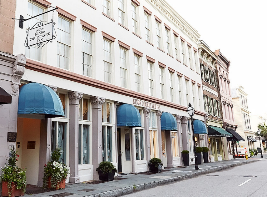 a row of buildings with awnings