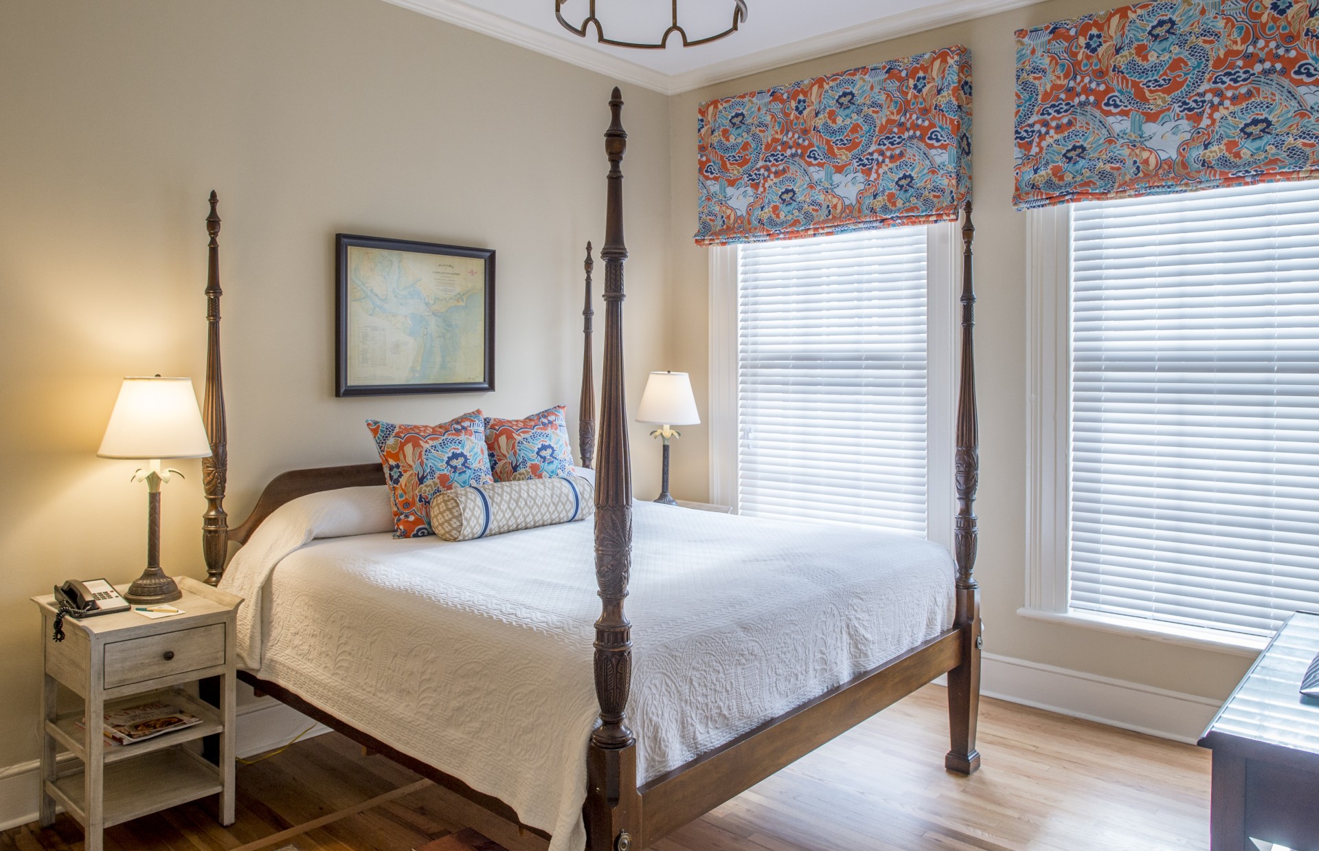 a bed with a four poster bed