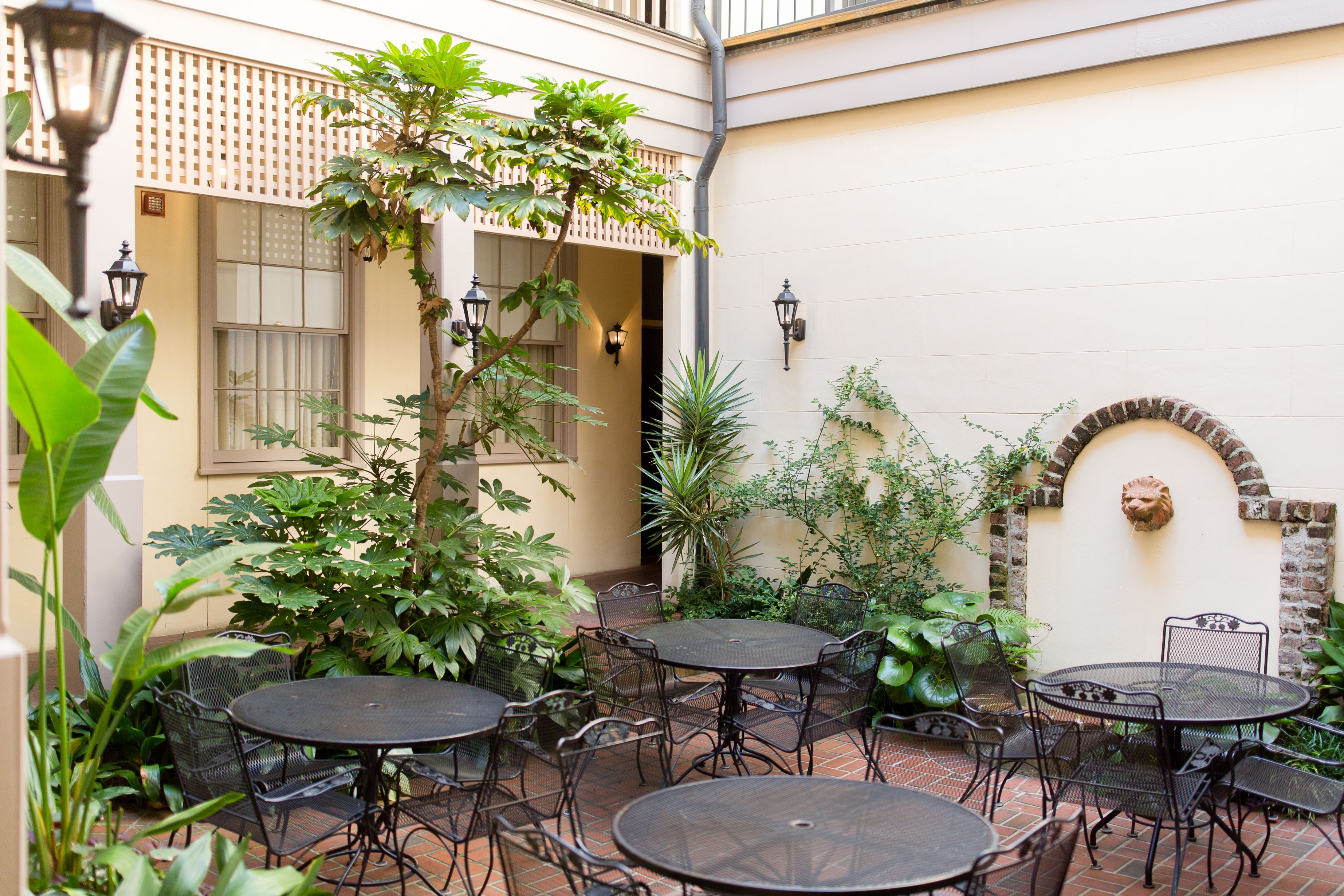 a patio with tables and chairs