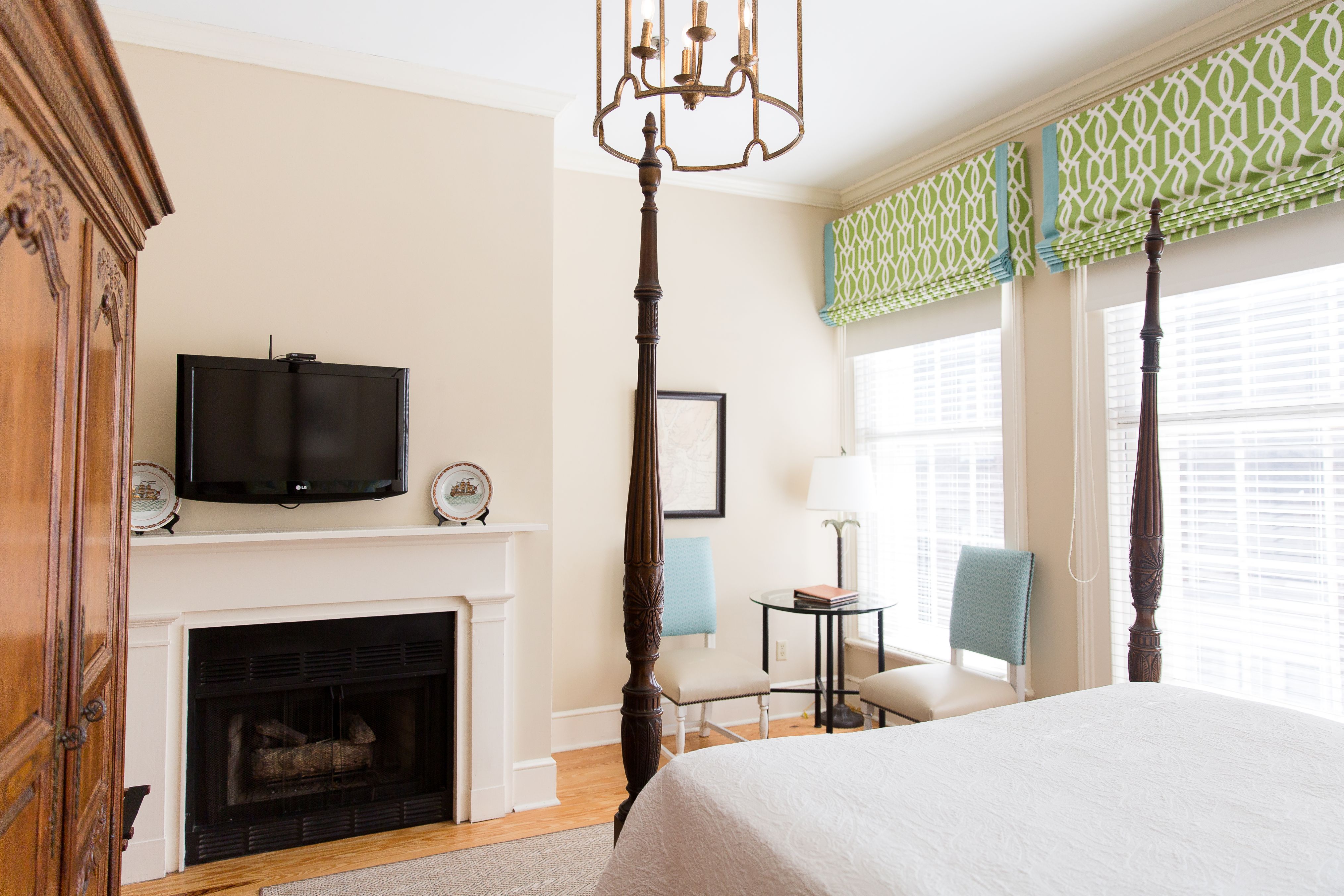 a room with a fireplace and a bed