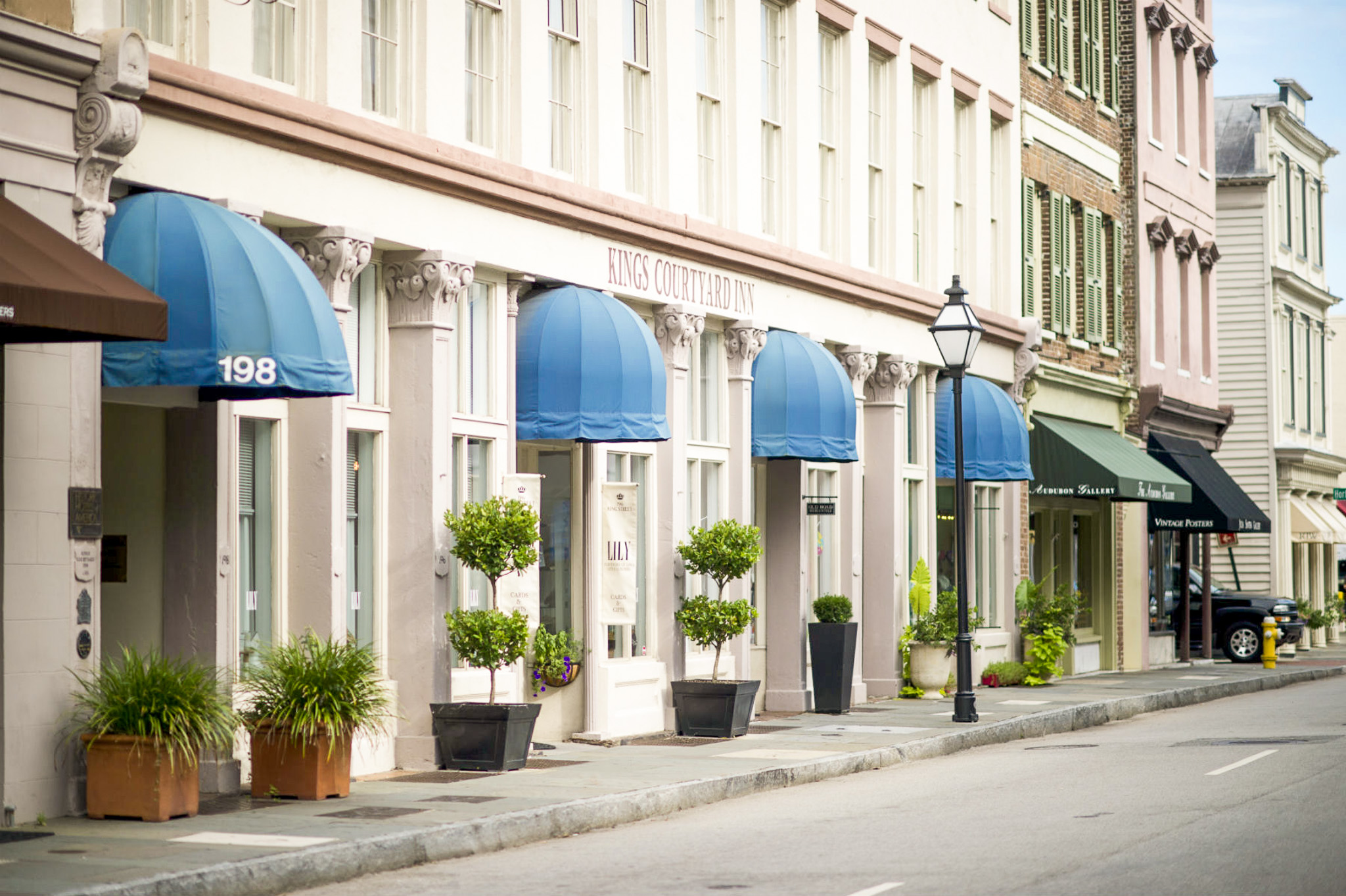 a building with blue awnings and a street light