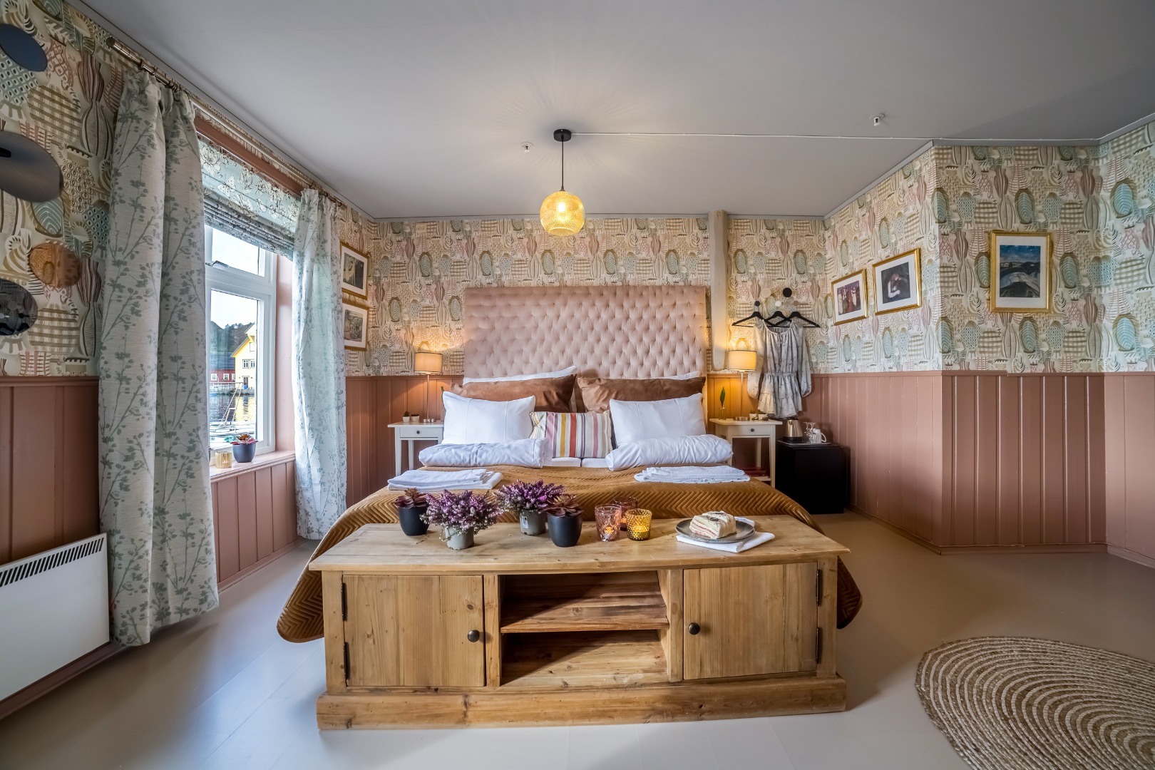 a room with a bed and a coffee table