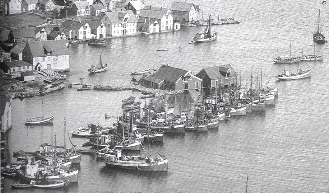 a group of boats in a harbor