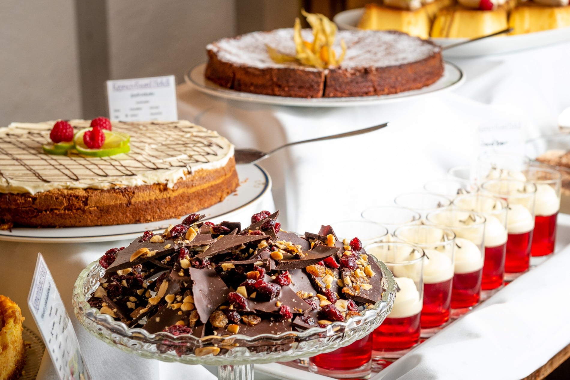 a table with desserts and drinks