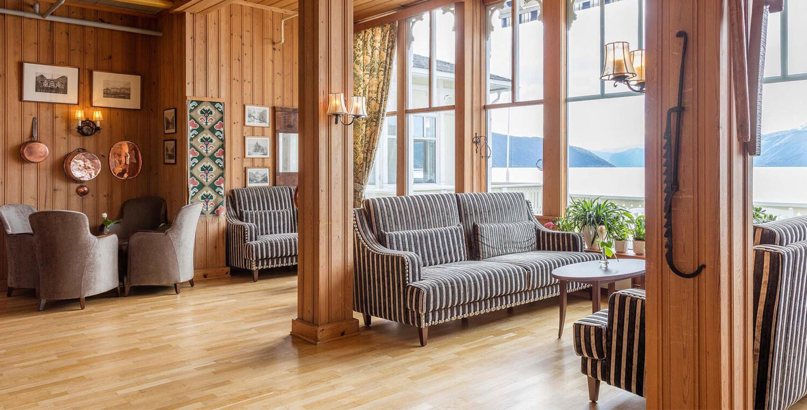 a room with a couch and chairs