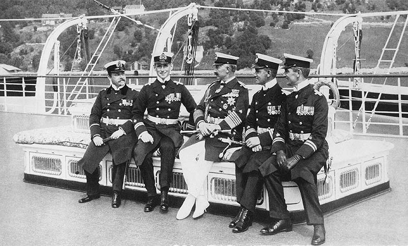 a group of men in military uniforms sitting on a boat