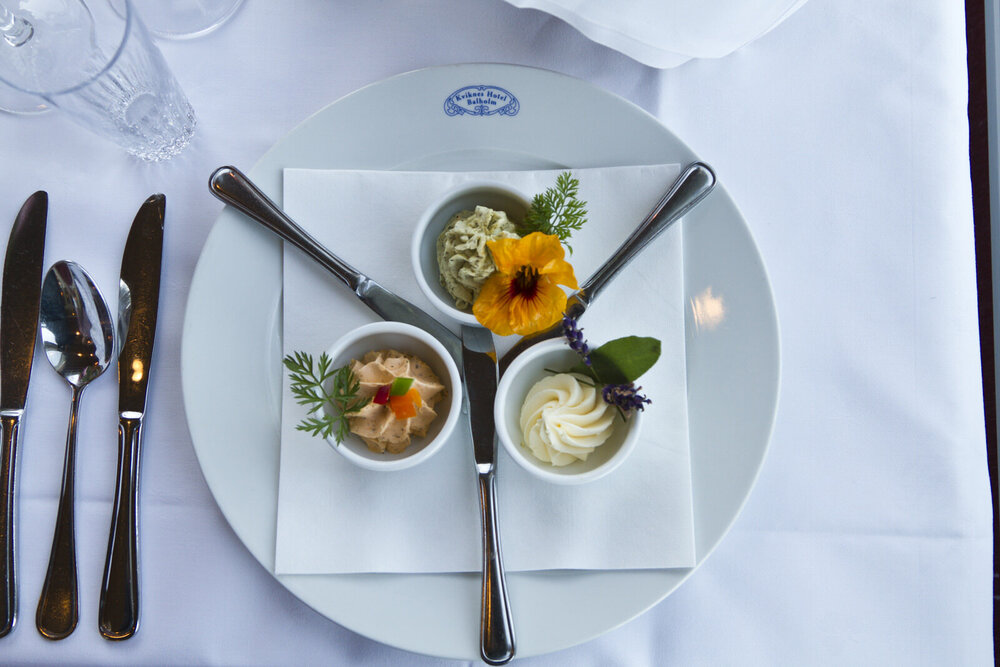 a plate with utensils and small bowls of food