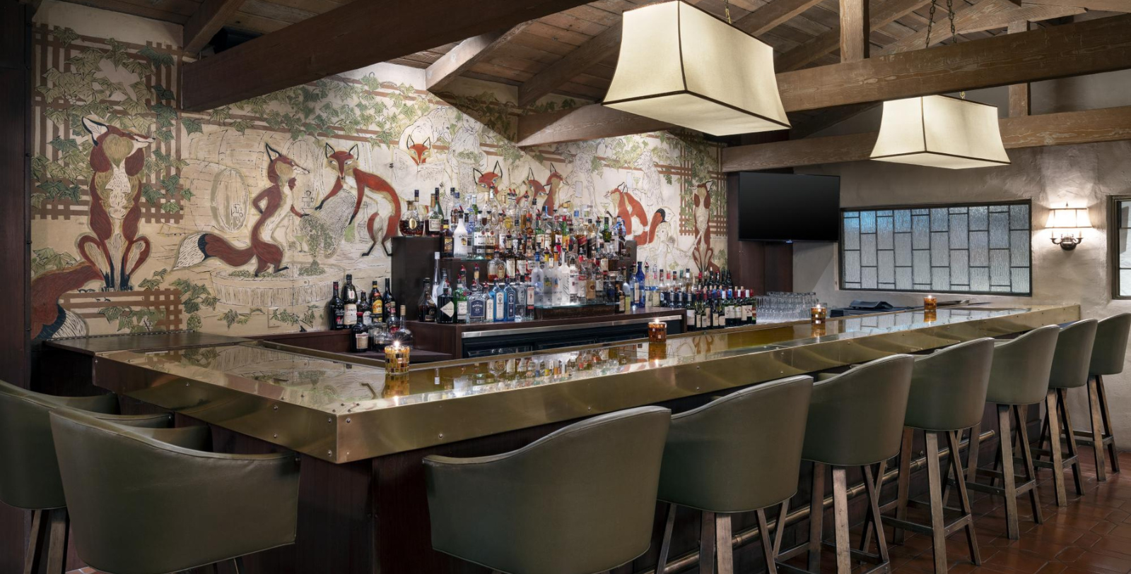 a bar with bottles of alcohol