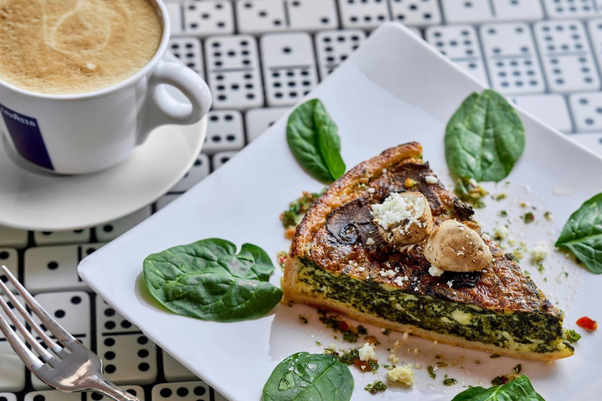 a plate of food and a cup of coffee
