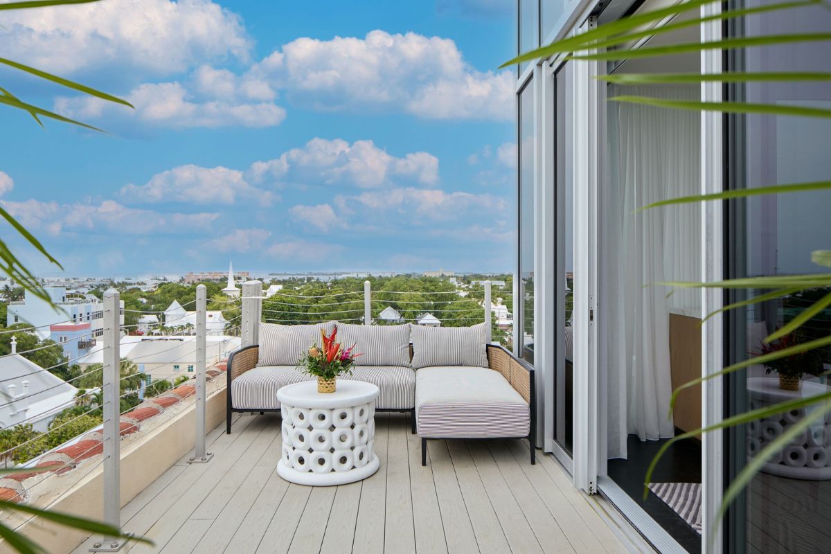 a couch and a table on a deck