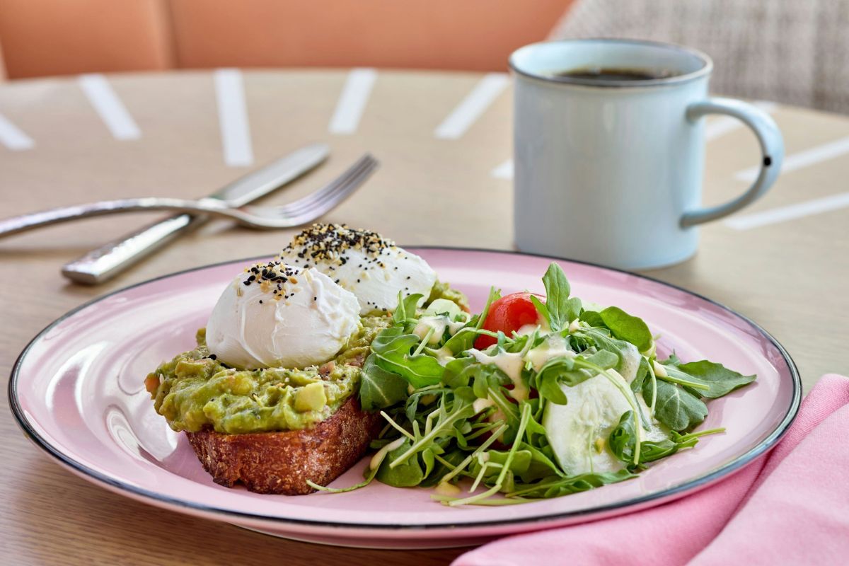 a plate of food and a cup of coffee