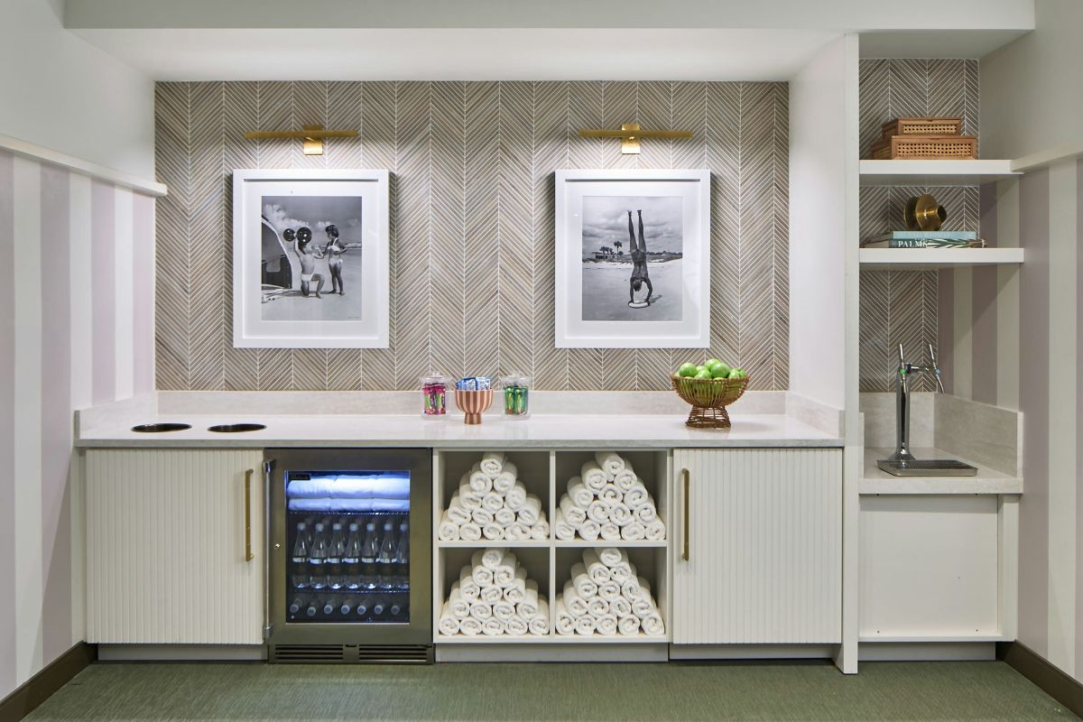 a room with a bar and pictures