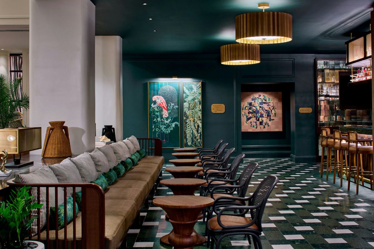a room with a couch and chairs
