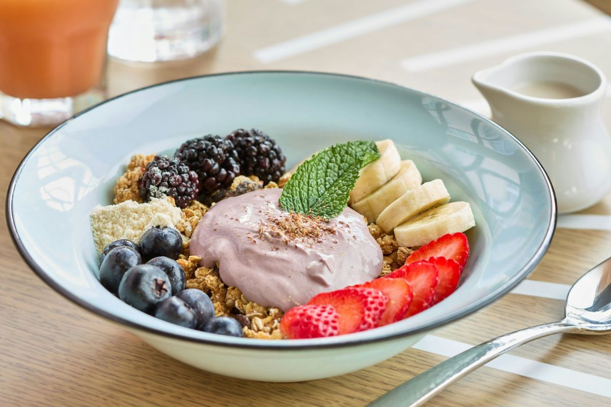 a bowl of fruit and yogurt