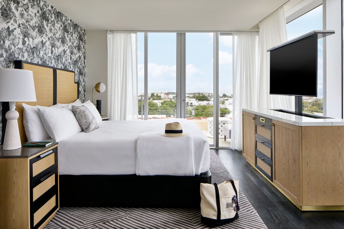 a bedroom with a large bed and a television
