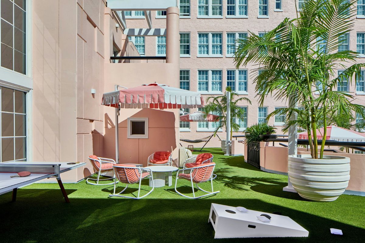 a patio with chairs and umbrellas