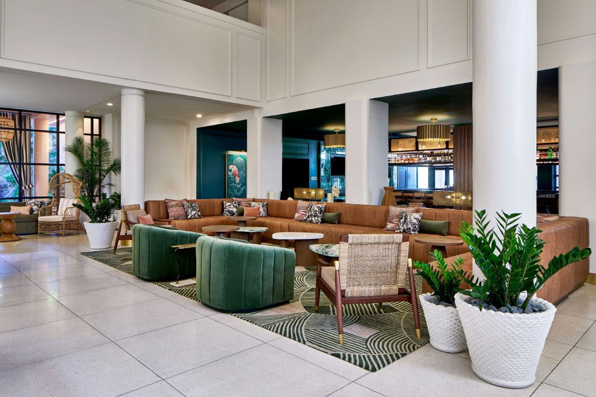 a large room with a large couch and chairs