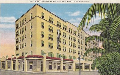a large building with palm trees