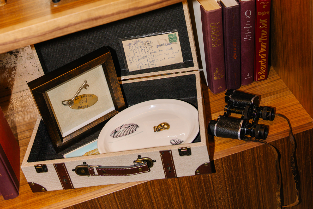 a box with a picture and binoculars on a shelf