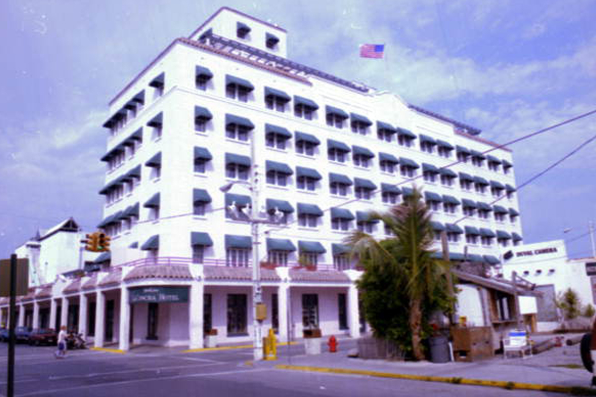 a white building with a flag on the top