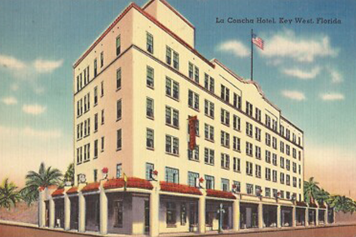 a large white building with a flag on the top