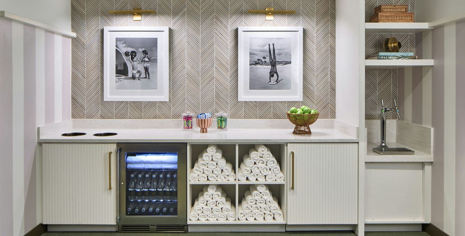 a room with a fridge and pictures
