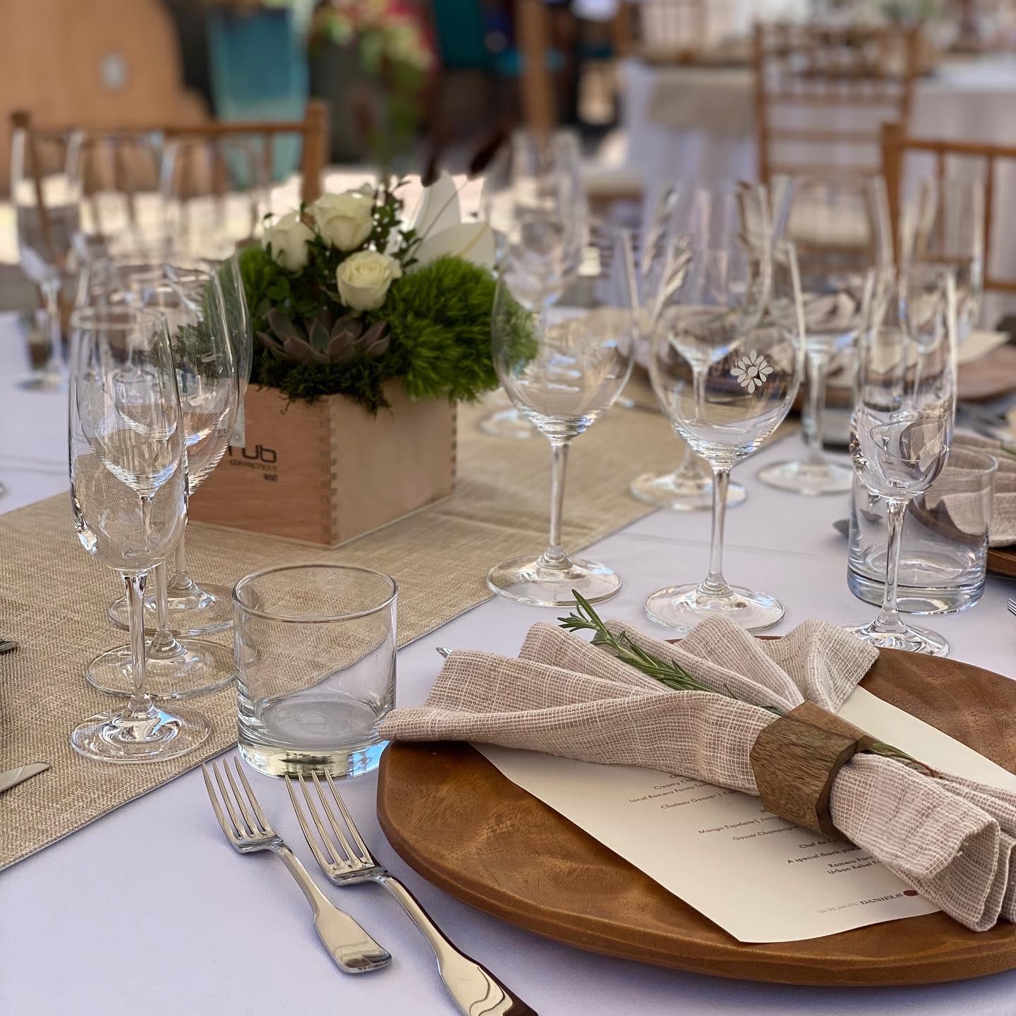 a table set with glasses and napkins