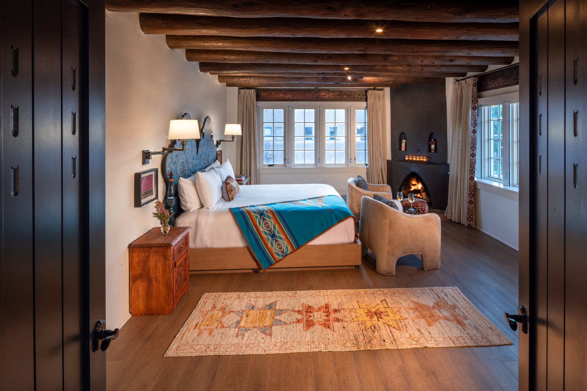 a room with a bed and fireplace