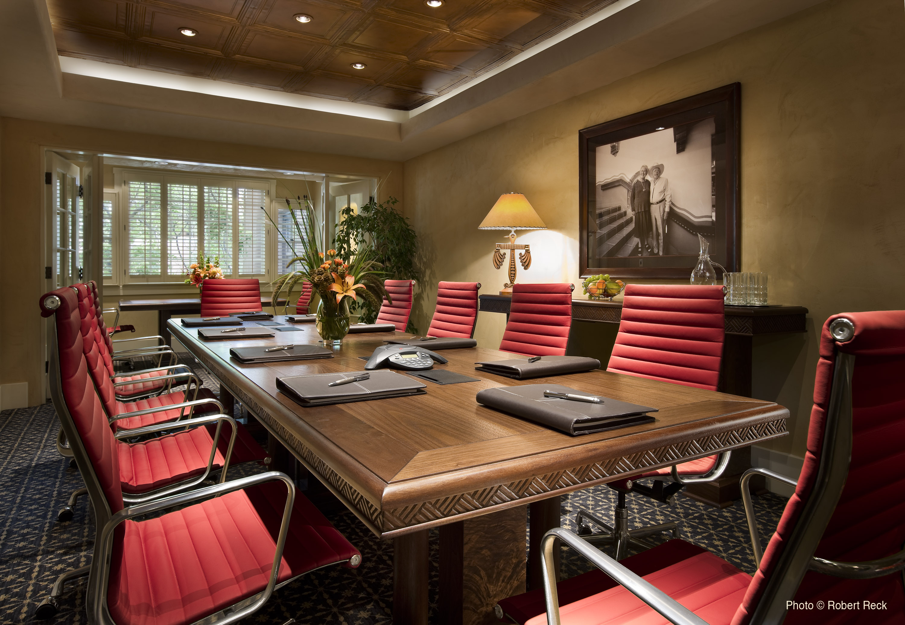 a conference room with a table and chairs