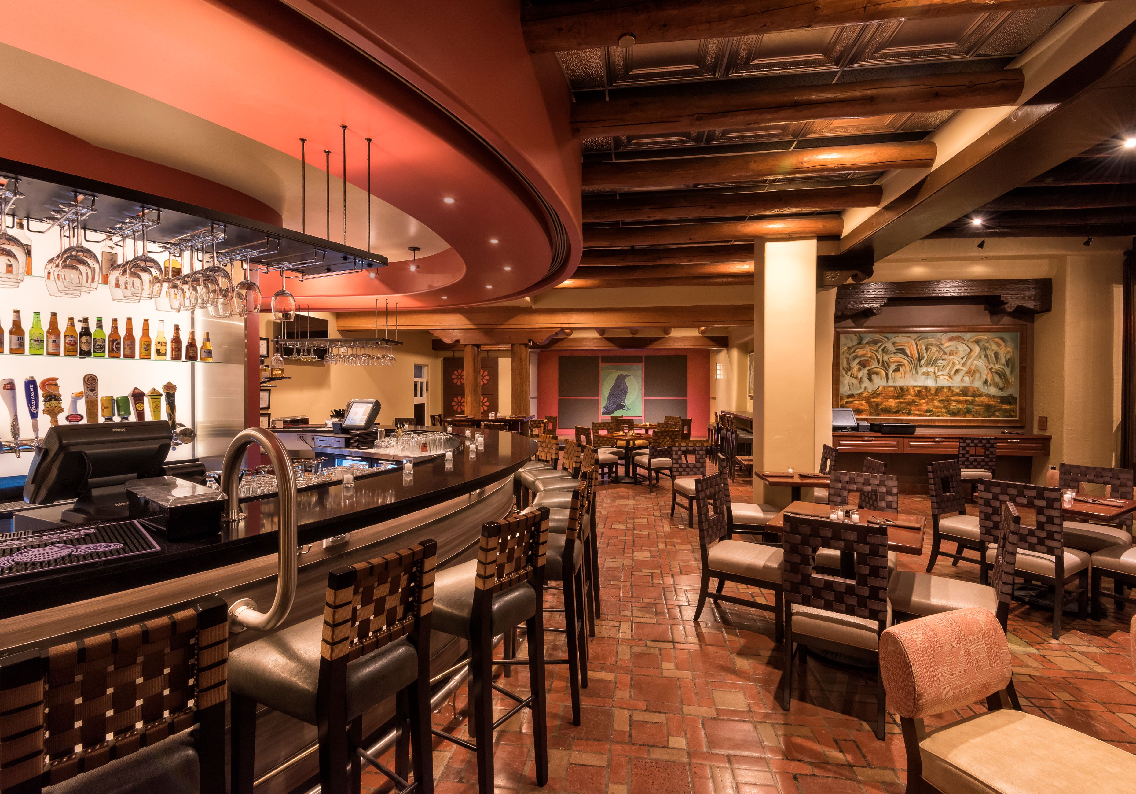 a bar with chairs and tables