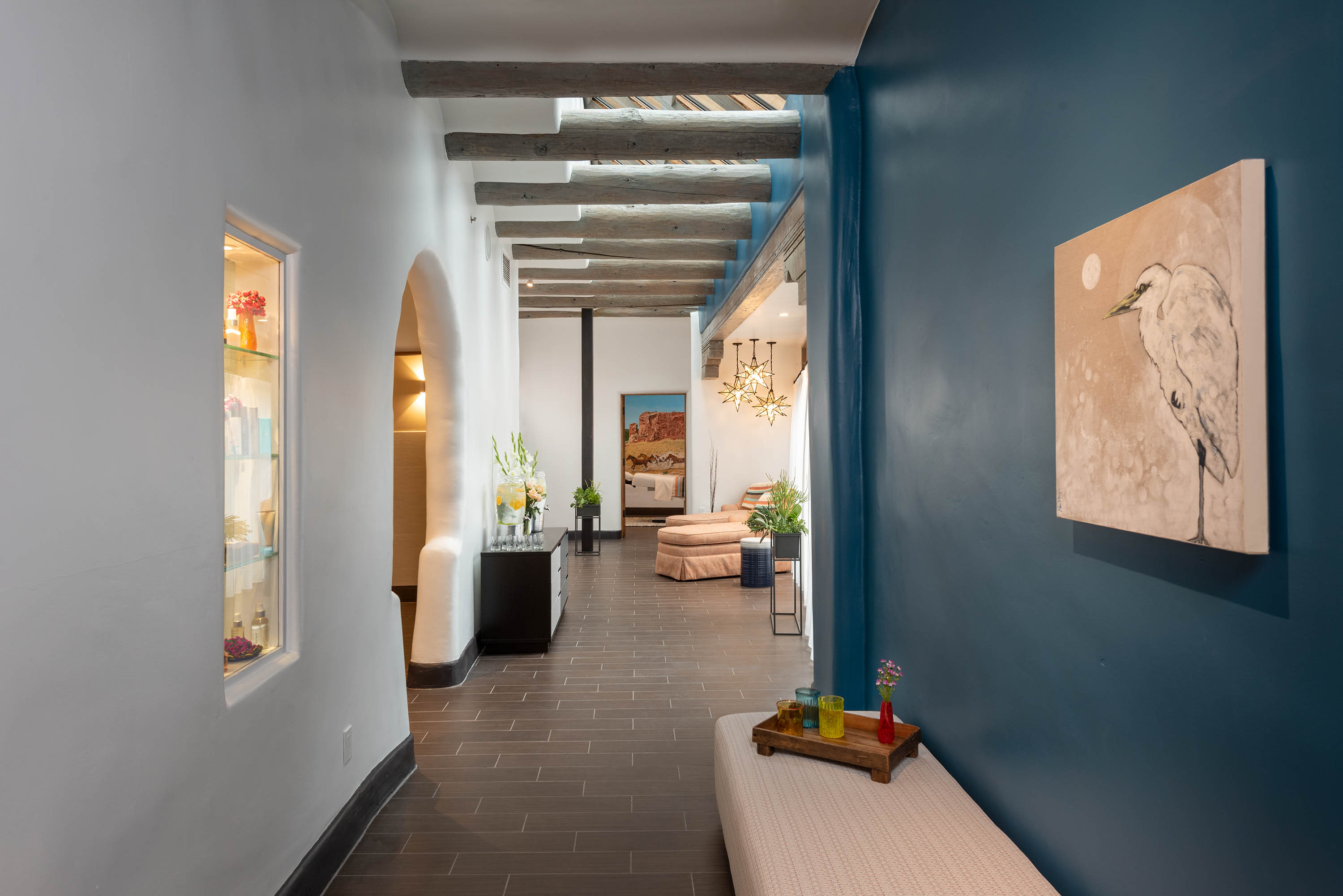 a hallway with a bench and shelves