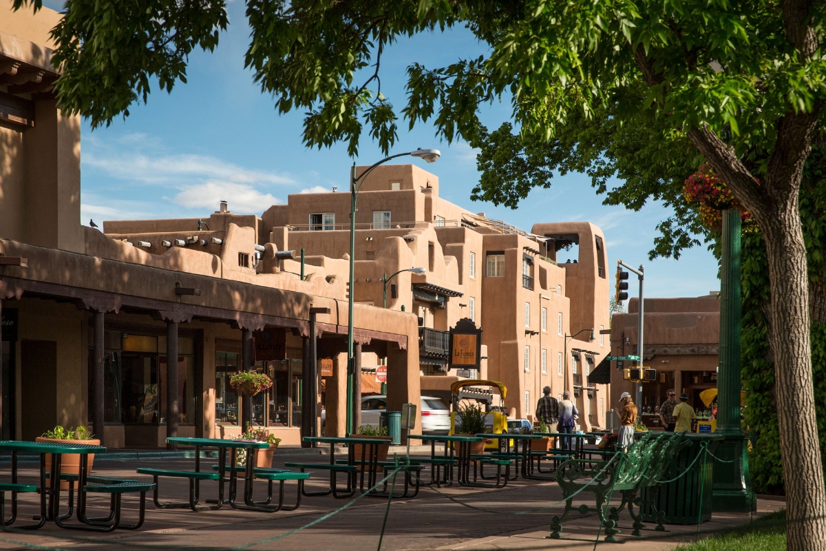 a group of people sitting on benches in a city