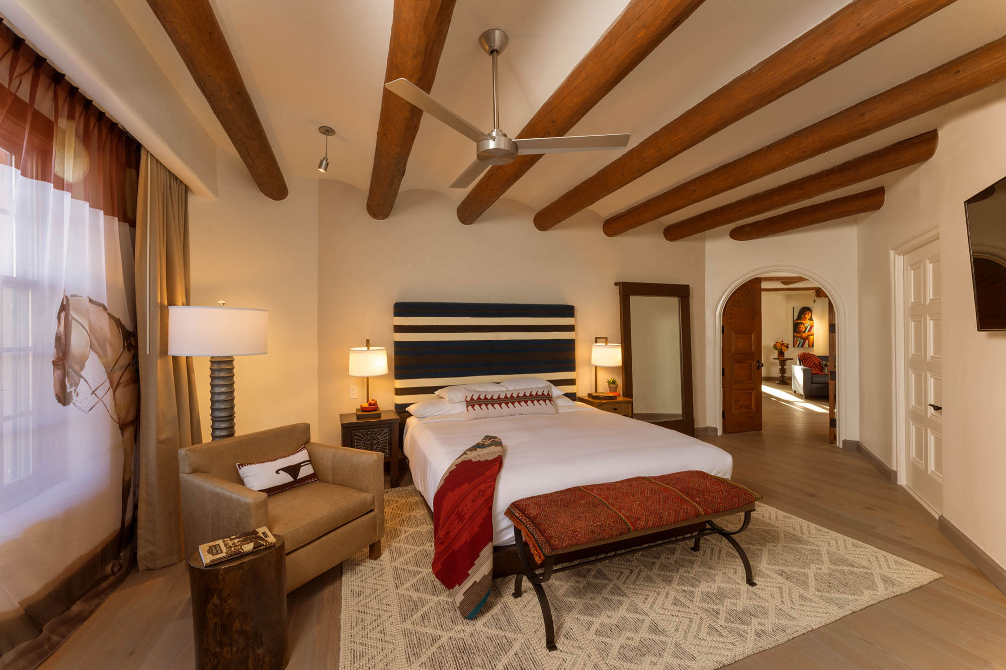 a bedroom with a bed and a chair