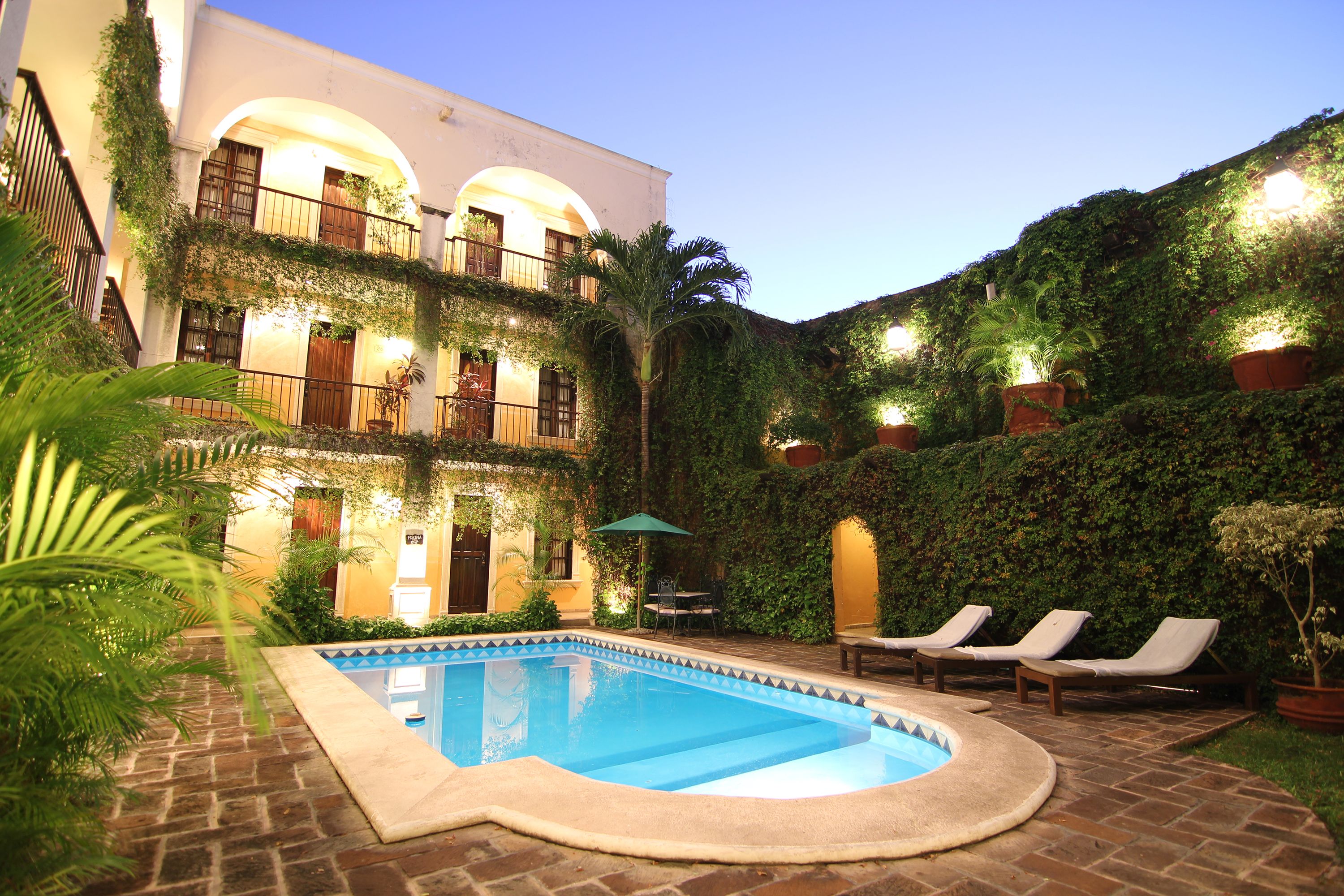 a pool in a courtyard of a building