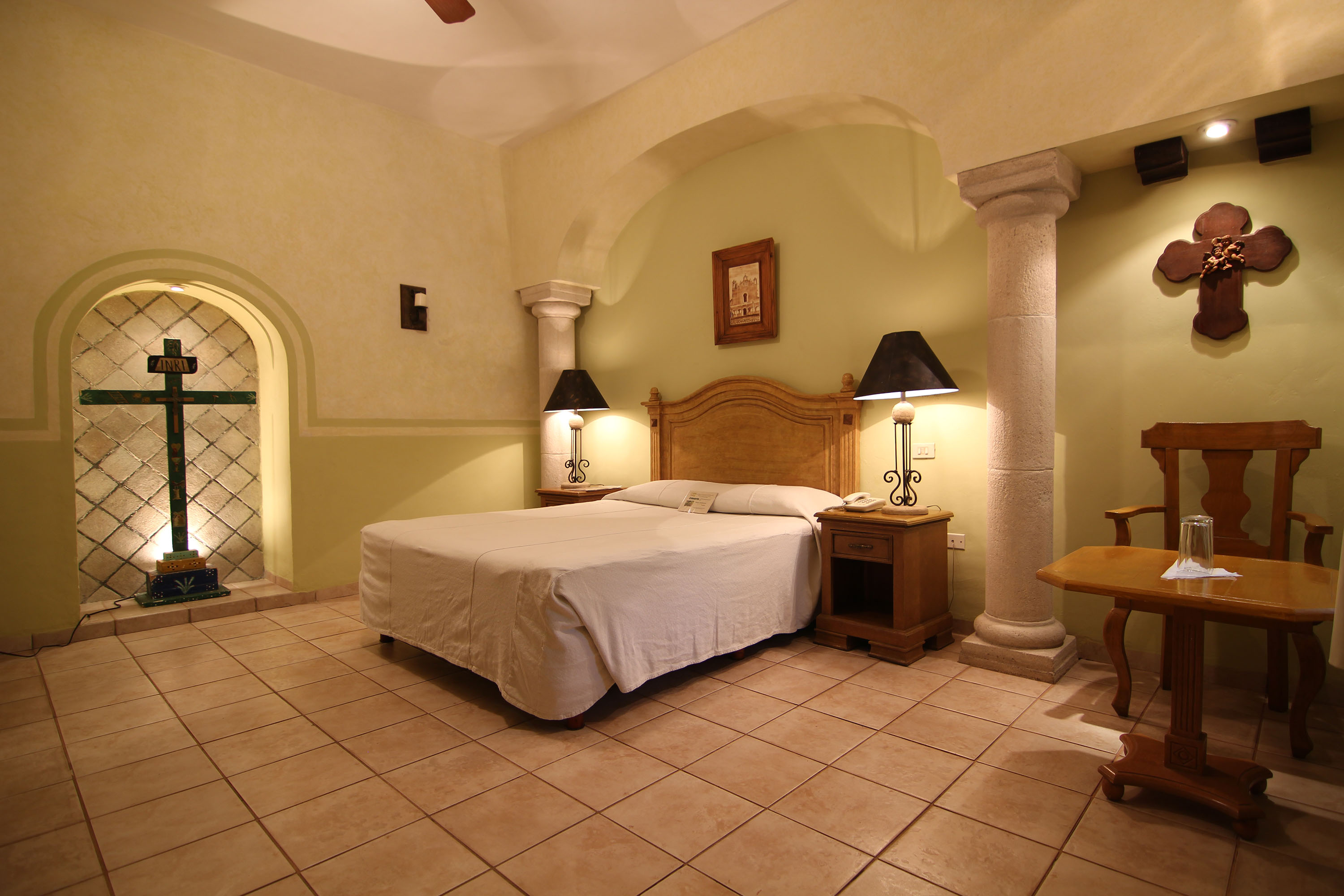a bedroom with a bed and a table