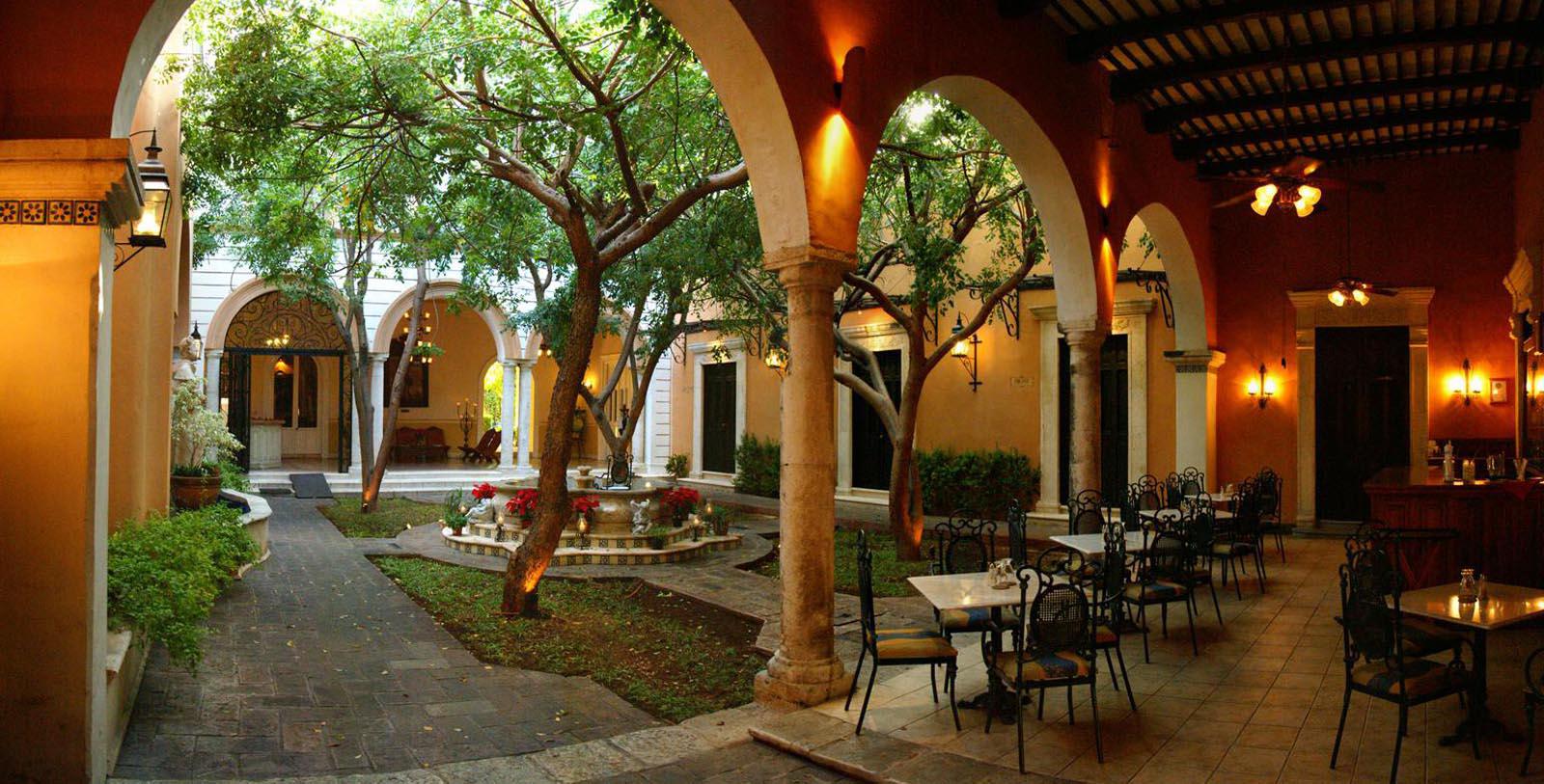 a courtyard with tables and chairs