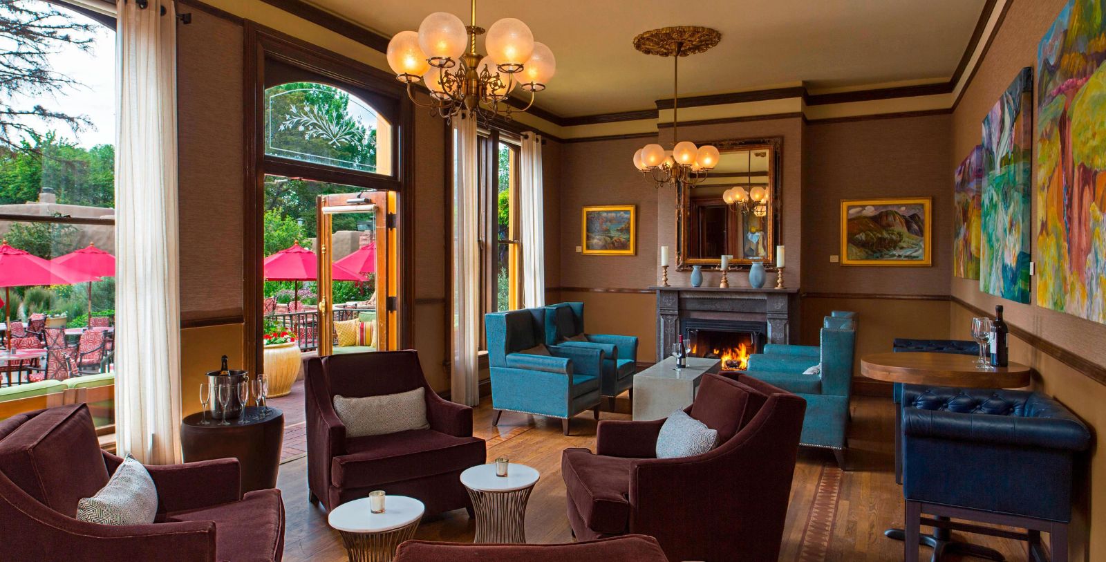 a room with a fireplace and chairs